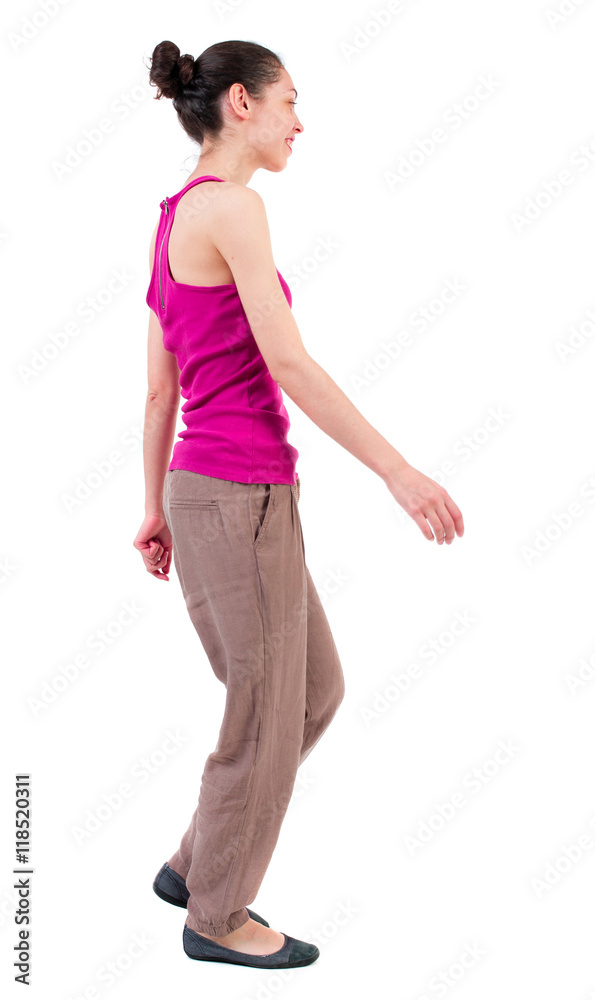 back view of walking woman. beautiful girl in motion. backside view of person. Rear view people collection. Isolated over white background. dark smiling girl walks past back view of walking woman. beautiful girl in motion. backside view of person. Rear view people collection. Isolated over white background. dark smiling girl walks past