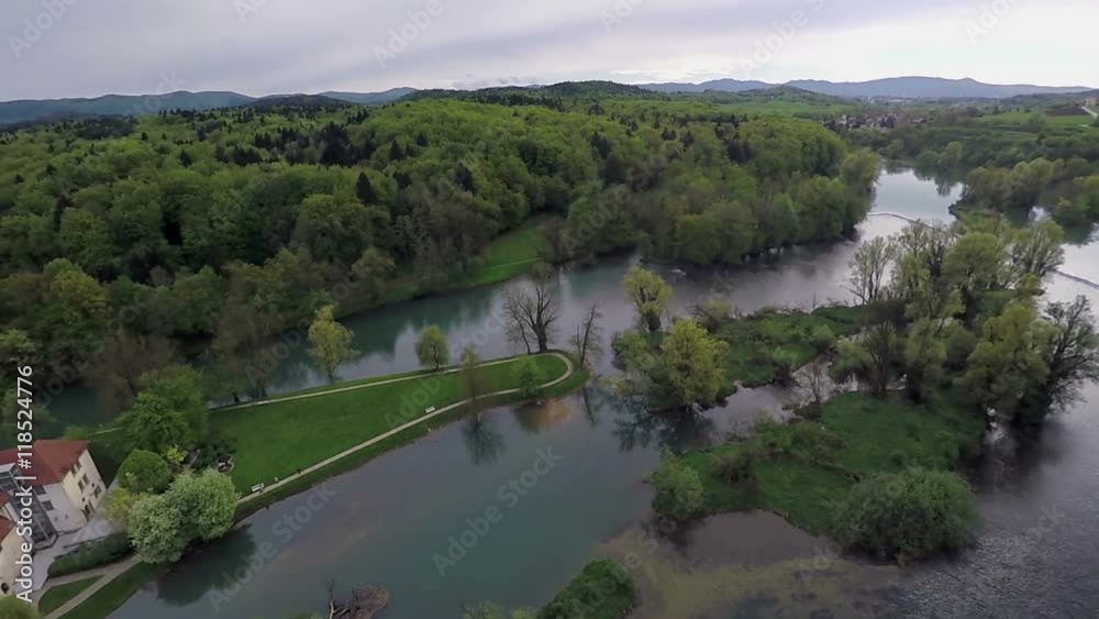 There is a castle on the island and there is also a lot of water around. Many forests and trees are surrounding this area, too. Wide-angle aerial shot.
There is a castle on the island and there is also a lot of water around. Many forests and trees are surrounding this area, too. Wide-angle aerial shot.