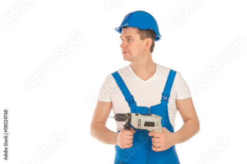 young builder looking away in blue uniform