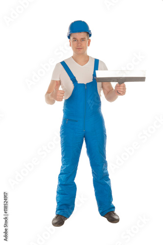 young male builder with putty knife