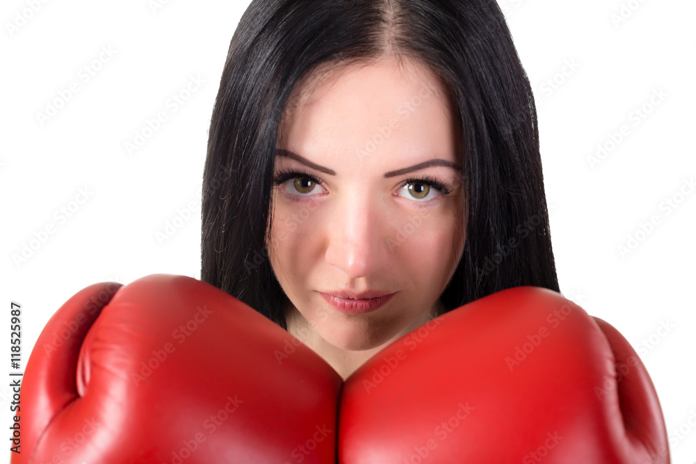 Portrait of serious young brunette woman with red boxing gloves. Portrait of serious young brunette woman with red boxing gloves.