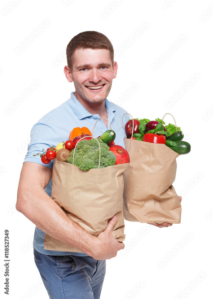 Happy man hold bag with healthy food, grocery buyer isolated Happy man hold bag with healthy food, grocery buyer isolated