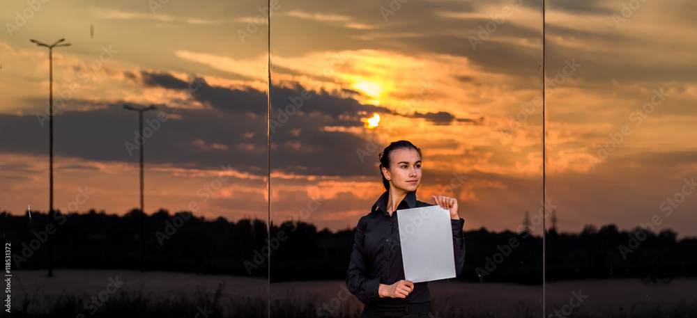 beautiful business girl with white piece of paper