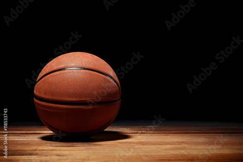 Basketball on a hardwood court floor