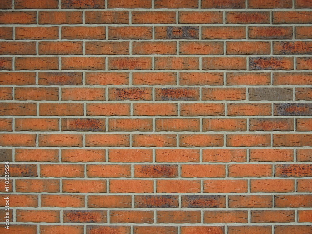 Background of a wall with red and orange bricks Background of a wall with red and orange bricks