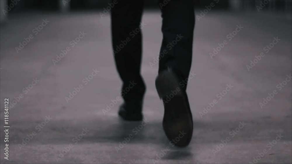 Businessman walking on the sidewalk Businessman walking on the sidewalk