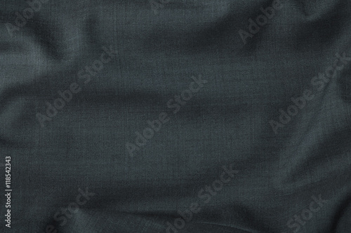 A full page close up of charcoal grey suit fabric texture