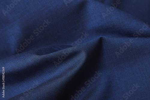 A full page close up of royal blue suit fabric texture