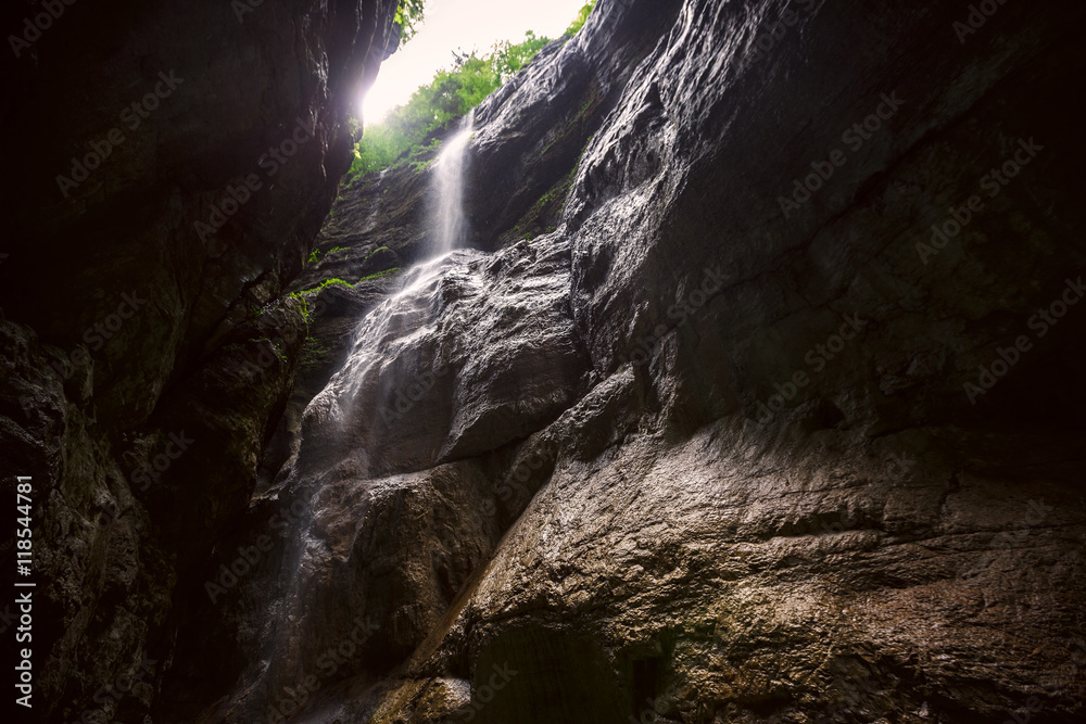 Waterfall in a mountain gorge