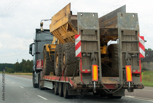 Canvas Print Heavy truck with trailer at highway.