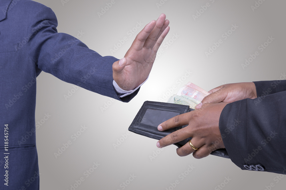 businessman holding money rejecting a bribe businessman holding money rejecting a bribe