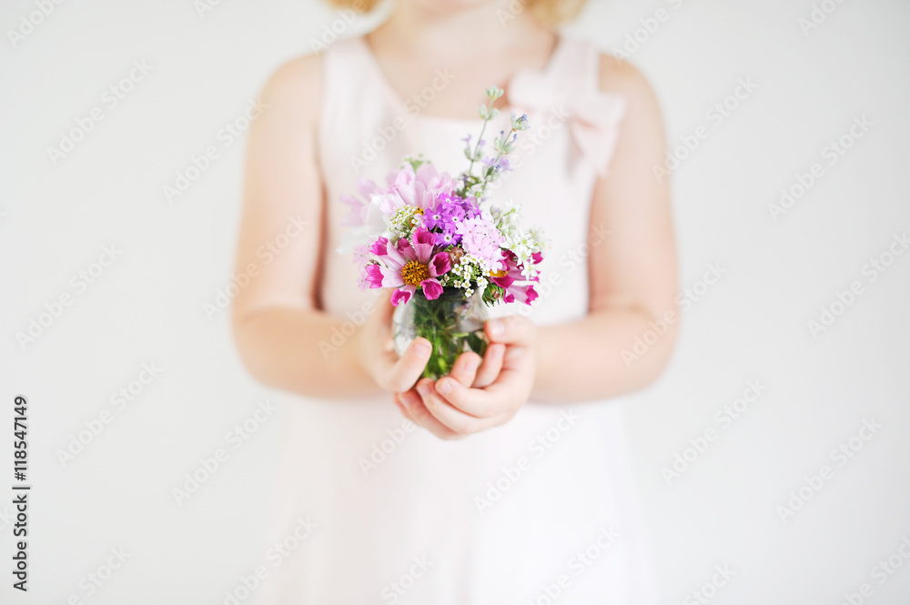 Girl holding a bouquet of flowers