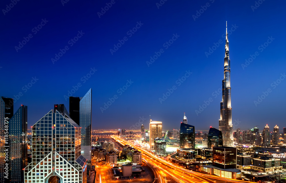 Naklejka premium Amazing sunset dubai downtown skyline with tallest skyscrapers and beautiful blue sky, Dubai, United Arab Emirates