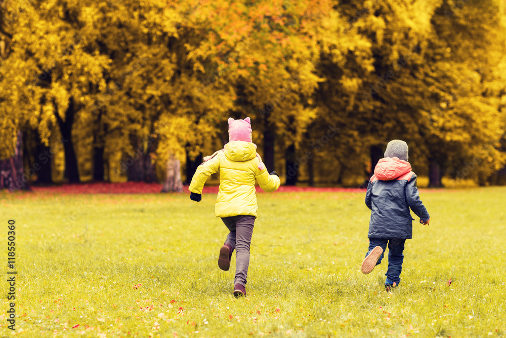 Fototapeta premium group of happy little kids running outdoors