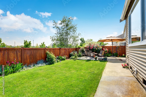 Beautiful landscape design for backyard garden and patio area photo