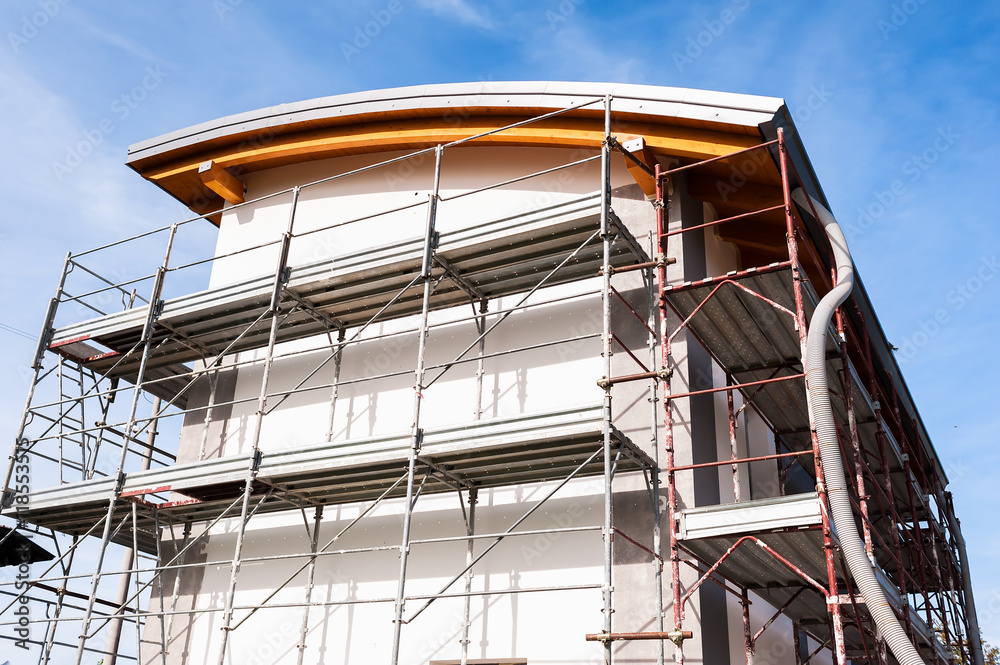 Construction scaffolding of a building under renovation. Construction scaffolding of a building under renovation.