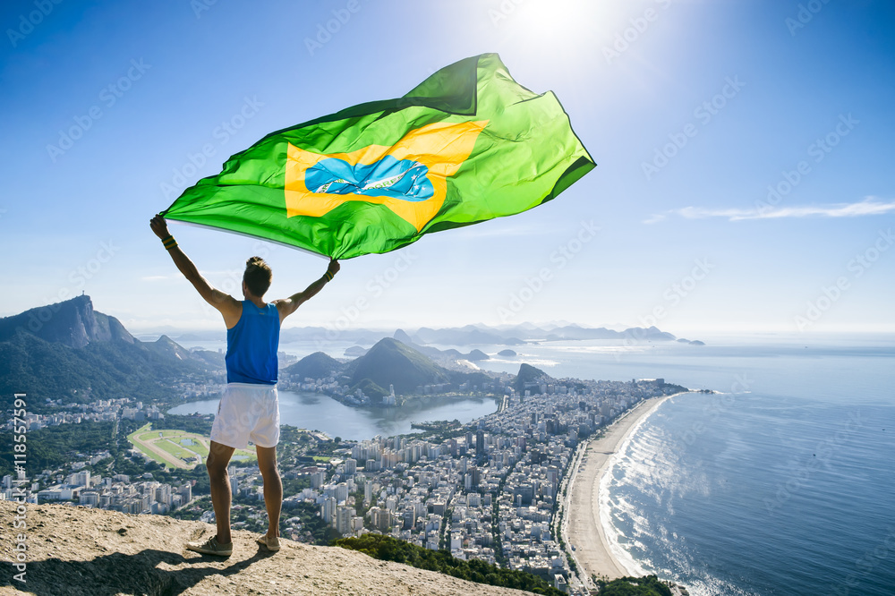 Athlete Stands Holding A Brazilian Flag At A Bright Overlook Of The City Skyline Of Rio De Janeiro Brazil Stock Photo Adobe Stock