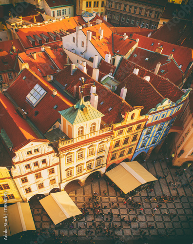 Red Prague roofs and square with lot of small people - view from the City Hall, travel european vintage hipster background