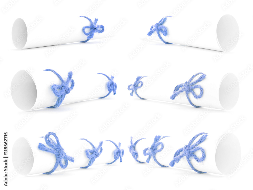 Obraz premium White paper rolls tied with blue ropes and nodes collection