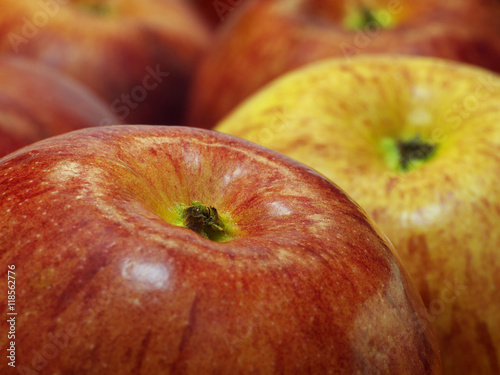 red and yellow apples closeup, macro, shallow depth of field