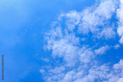 Blue sky background with white clouds. The vast blue sky and clouds sky on sunny day. White fluffy clouds in the blue sky. © phanthit malisuwan