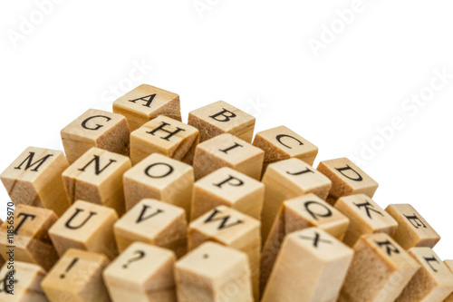 Letters of the English alphabet on the ends of wooden bars, isol