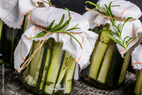 Marinated zucchini with rosemary in jars