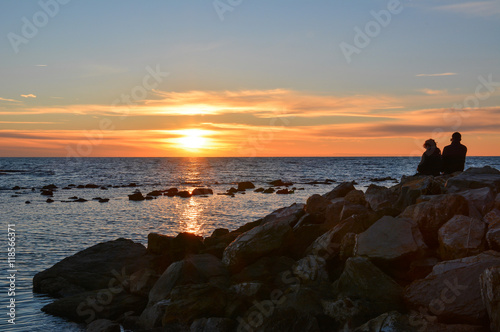 Medieval castle of Santa Severa (Rome, Italy) - Wintry sunset on the Adriatic sea, from the waterfront's reef 