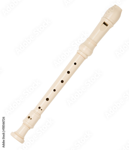 Plastic recorder woodwind instrument on white photo