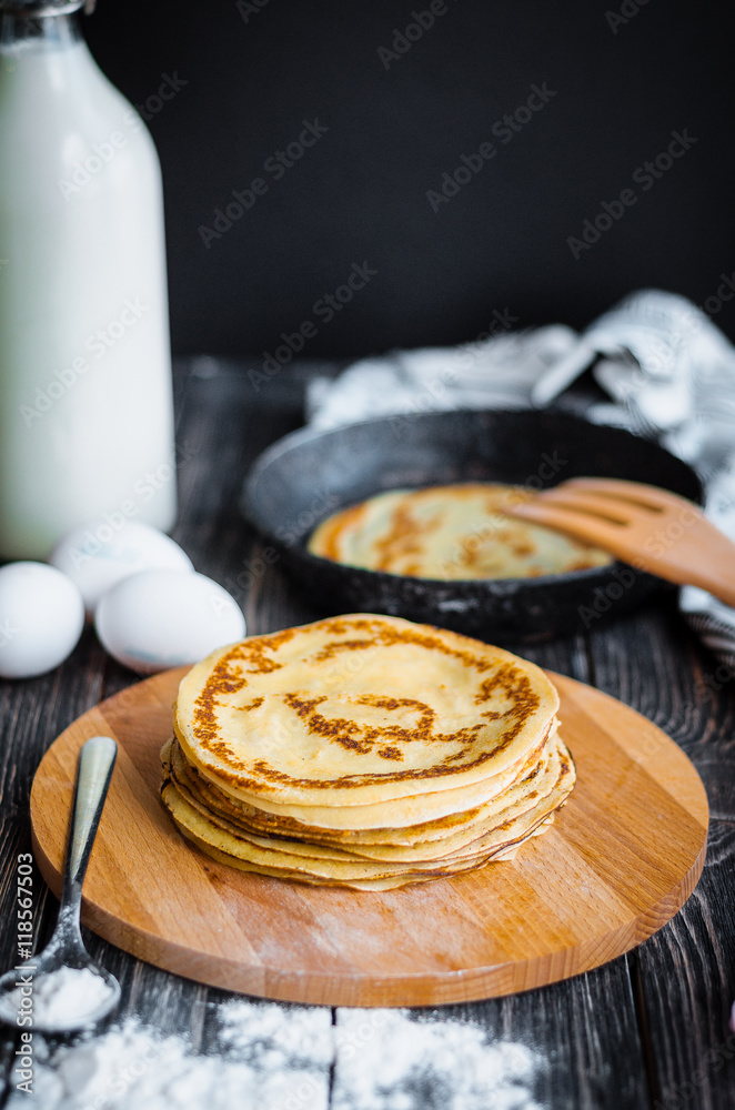 Delicious pancakes with jam on a wooden table Delicious pancakes with jam on a wooden table