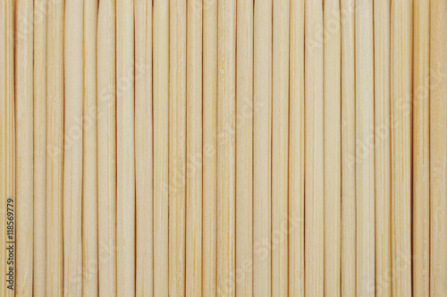 Vertical bamboo toothpicks line up in row