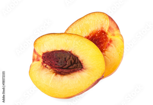 Nectarine fruit halves isolated on white background, close up