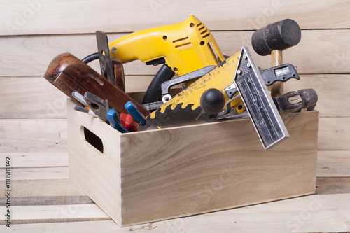 Φωτογραφία Construction tools on wooden table with sawdust