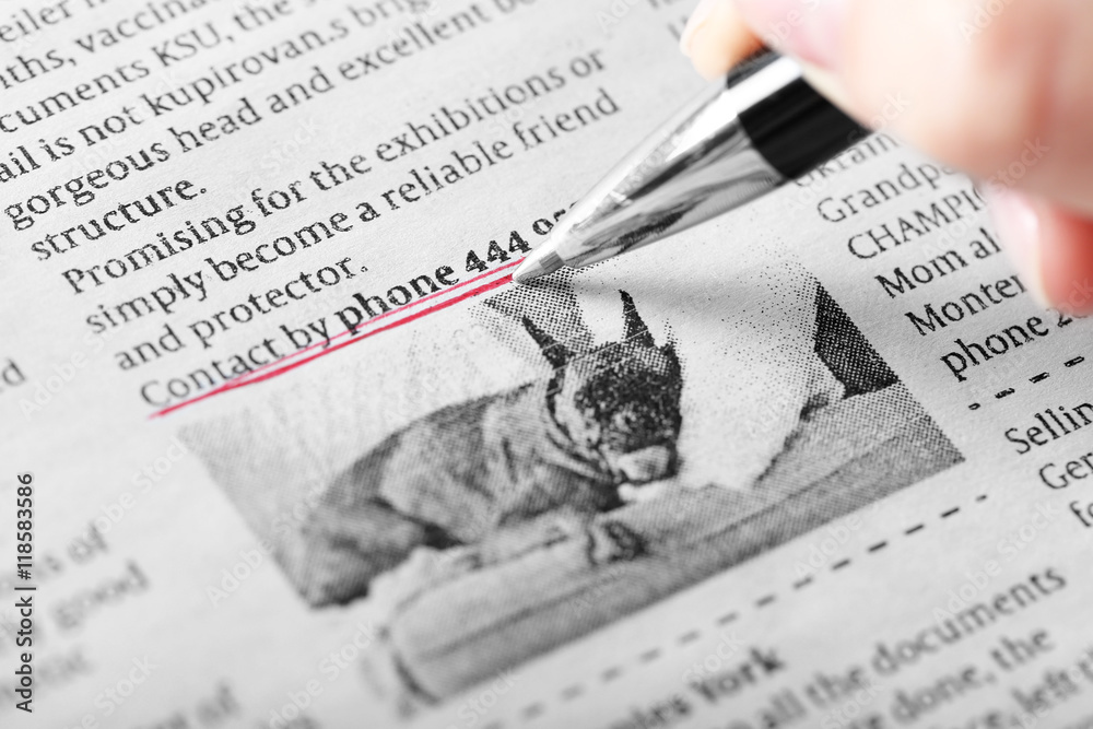 Naklejka premium Search newspaper advertisements for information