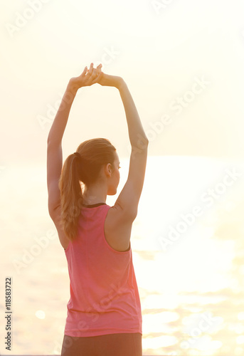 Young woman doing exercises...