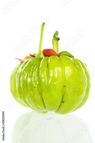 Close up garcinia cambogia with reflection on white background.