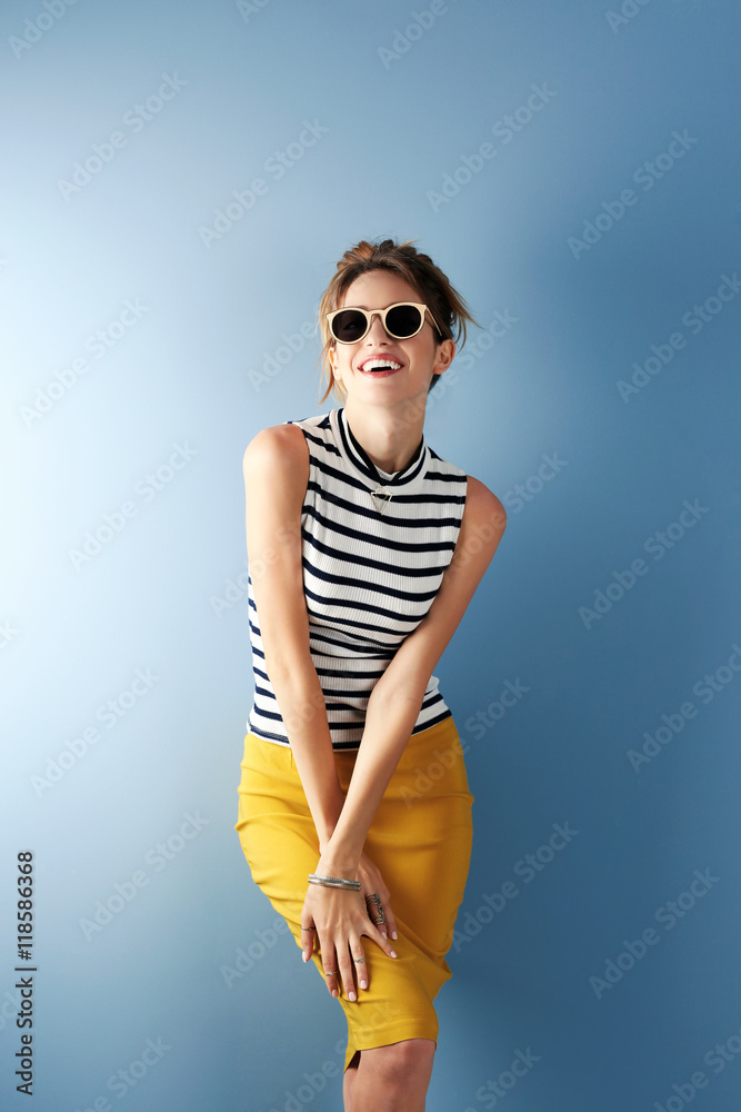Fototapeta premium Beautiful girl on blue background