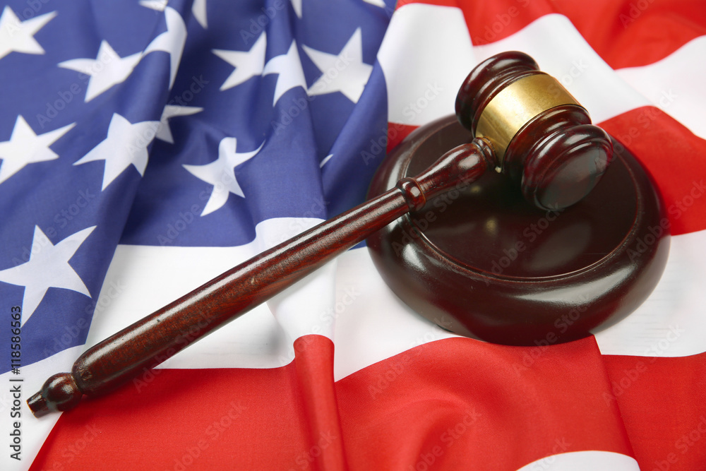 Judge gavel on American flag, closeup
