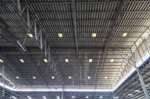 Fototapeta Naklejka Na Ścianę i Meble -  Corrugated metal roof for storage or warehouse. Insulation under roof protection surface heat.

