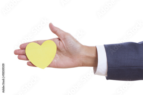 Businessman hand holding paper heart  isolated on white background. with using path 