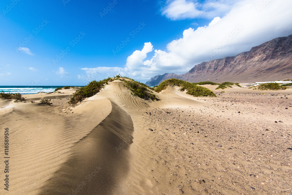 Sand dunes on the beach Famara.  Lanzarote. Canary Islands. Spain