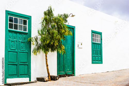 Street with green doors in Teguise.  Lanzarote. Canary Islands. Spain photo