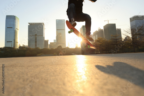 skateboarder doing an ollie trick at sunrise city