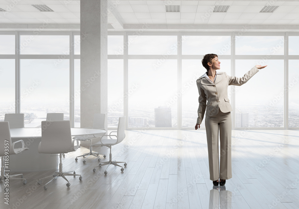 Fototapeta premium Businesswoman in office . Mixed media
