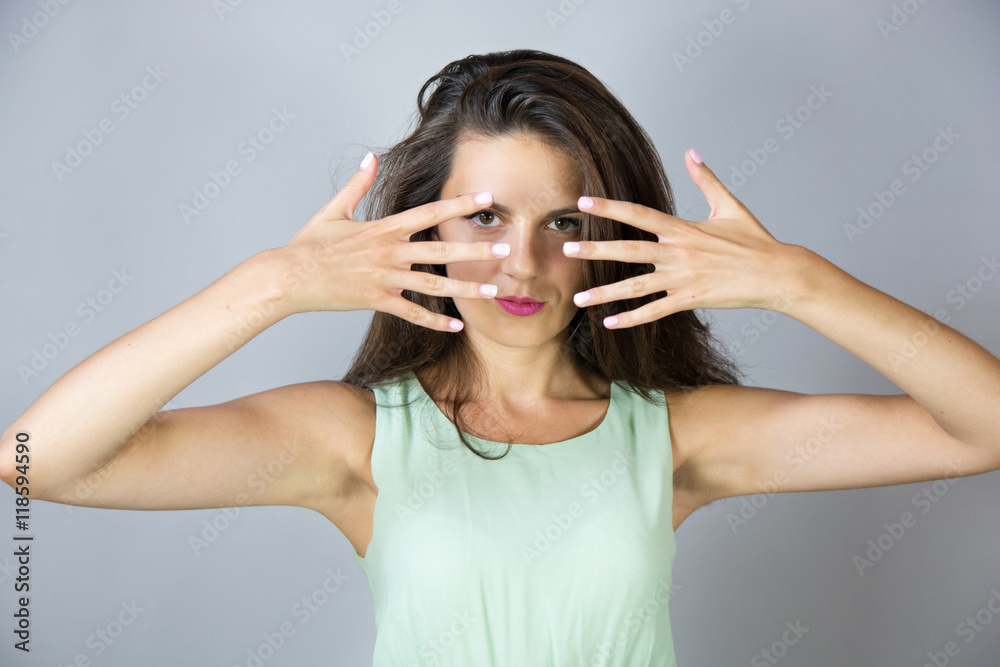 beautiful woman covering her face with hands beautiful woman covering her face with hands