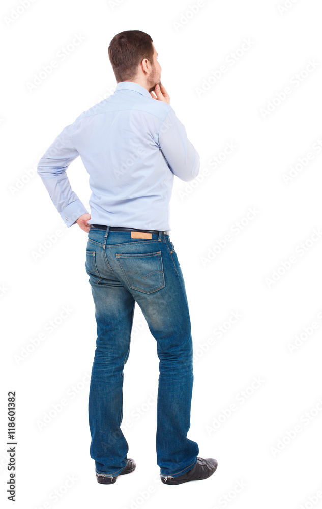 Back view of man . Standing young guy. Rear view people collection. backside view of person. Isolated over white background. Bearded businessman thoughtful touches his chin. Back view of man . Standing young guy. Rear view people collection. backside view of person. Isolated over white background. Bearded businessman thoughtful touches his chin.