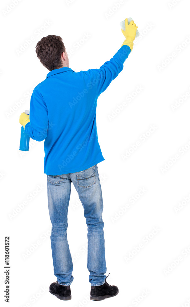 Back view of a cleaner man in gloves with sponge and detergent. girl watching. Rear view people collection. backside view of person. Isolated over white background. Curly boy in a warm blue sweater Back view of a cleaner man in gloves with sponge and detergent. girl watching. Rear view people collection. backside view of person. Isolated over white background. Curly boy in a warm blue sweater