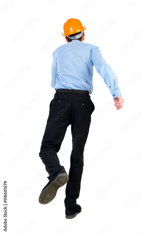 Back view of running engineer in helmet. Walking guy in motion. Rear view people collection. Backside view of person. Isolated over white background. Businessman in blue shirt and hat jumping on one Back view of running engineer in helmet. Walking guy in motion. Rear view people collection. Backside view of person. Isolated over white background. Businessman in blue shirt and hat jumping on one