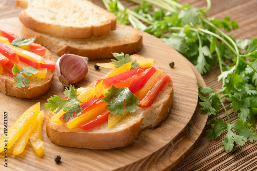 Fresh and tasty bruschetta with color pepper, coriander