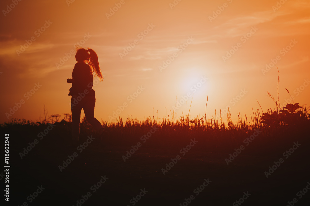 teenage girl runner countryside in sunset